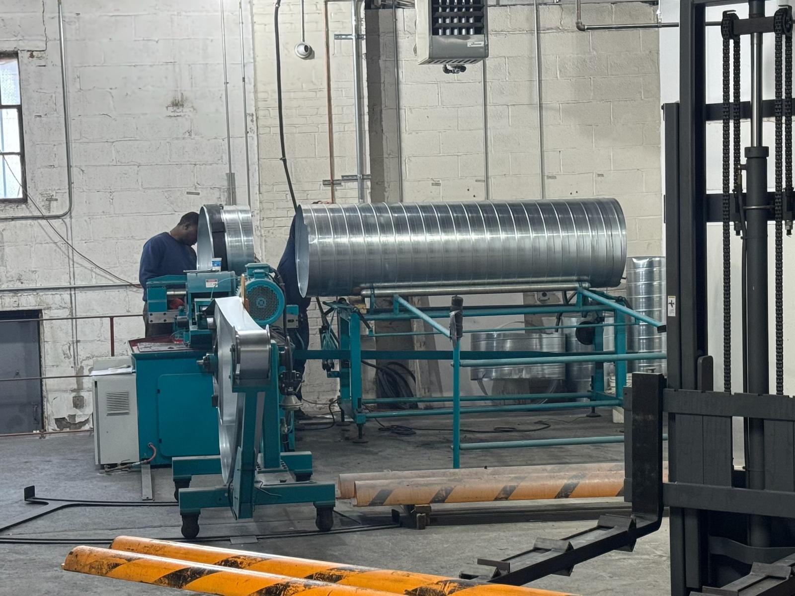 Spiral duct forming line in the fabrication shop