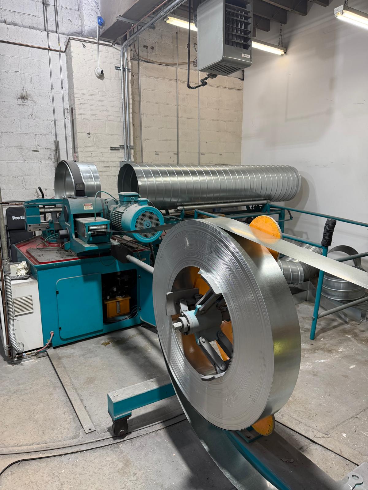 Metal coil feeding spiral duct production equipment