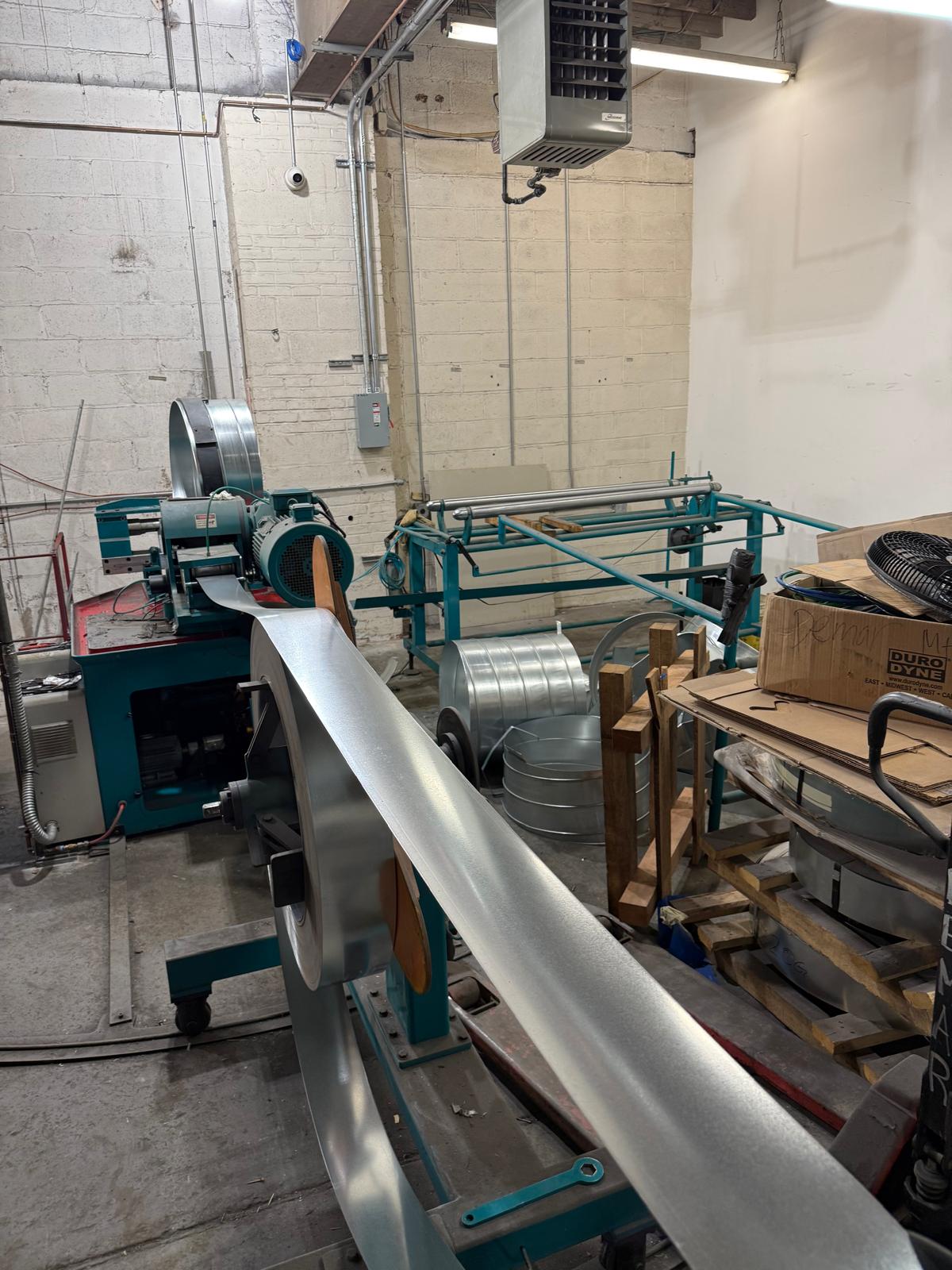 Sheet metal moving through fabrication machinery