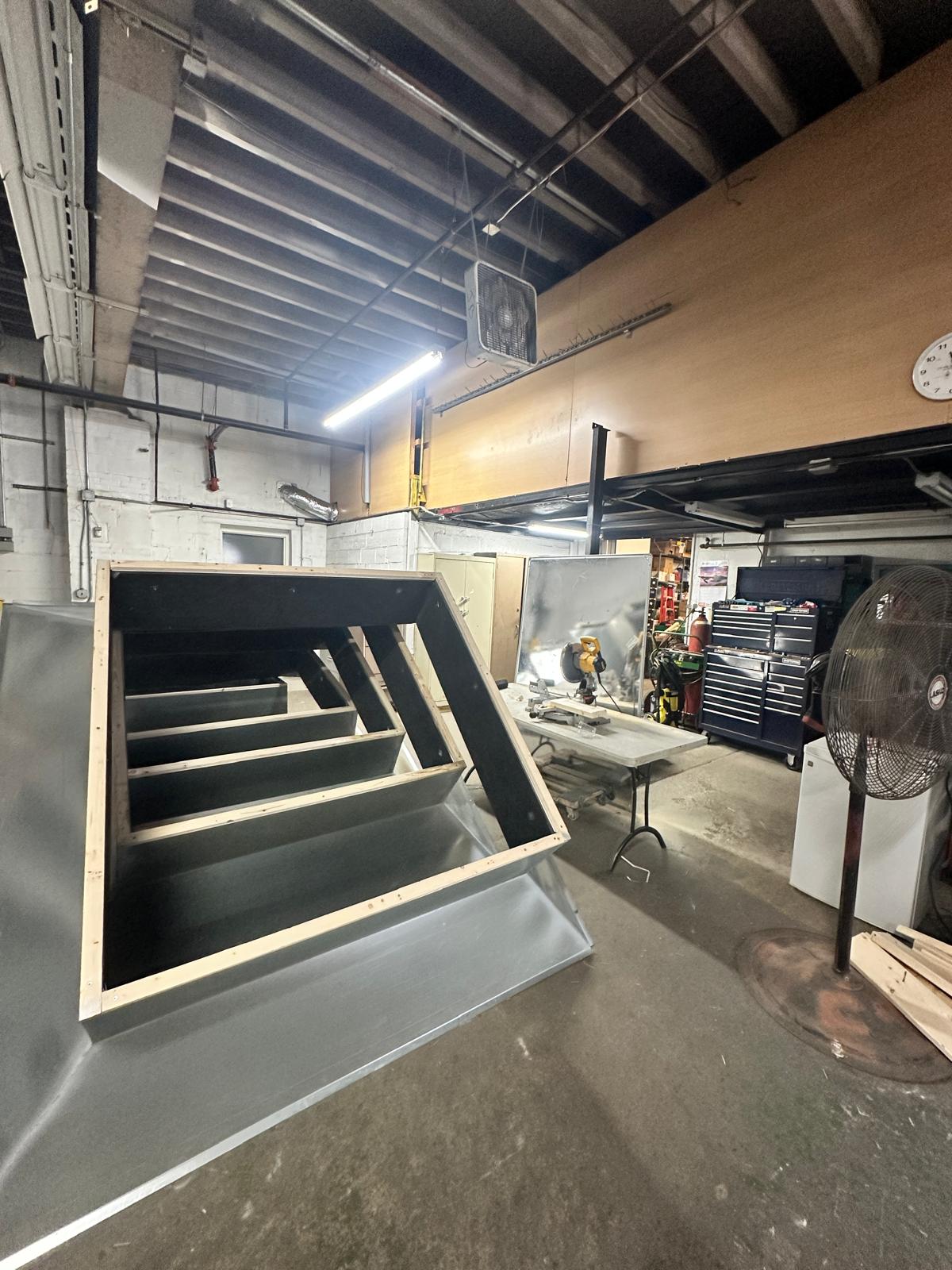 Fabricated sheet metal curb assembly with internal openings